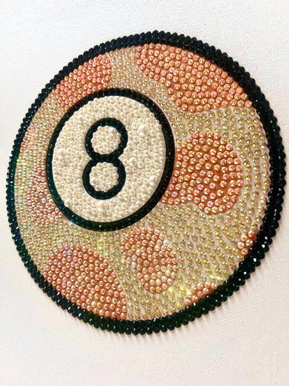 Rhinestone-bedazzled 8-ball image, orange cowprint pattern.